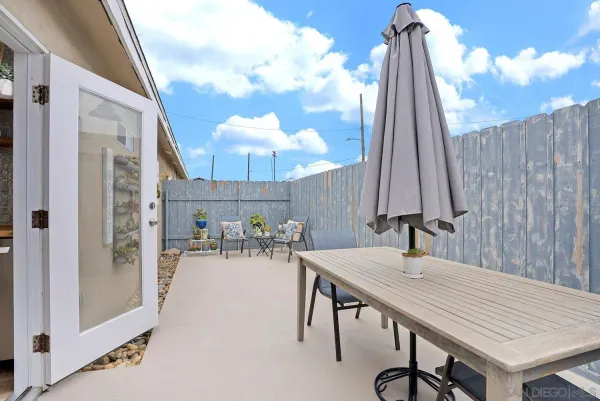 a kitchen with a table and chairs in it