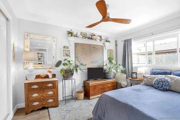 a bedroom with a bed and a couch