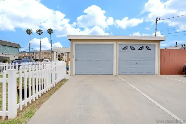 a view of a patio with dining table and chairs with wooden floor