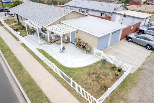 swimming pool view with a sitting space and garden view