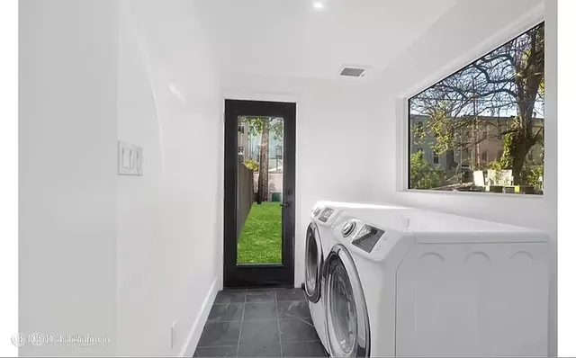 a utility room with dryer and washer