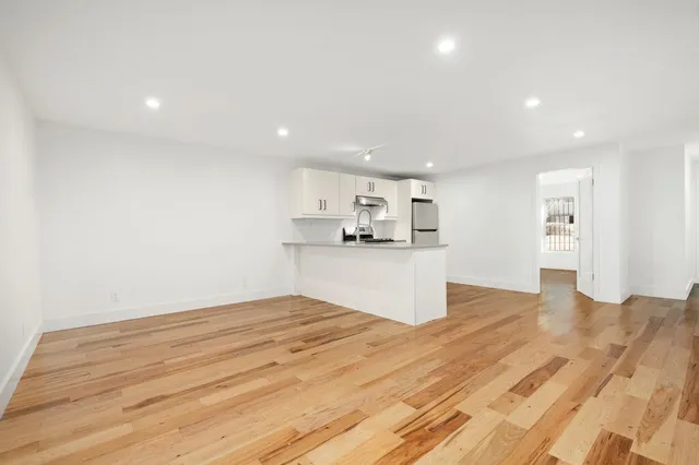a view of kitchen with wooden floor