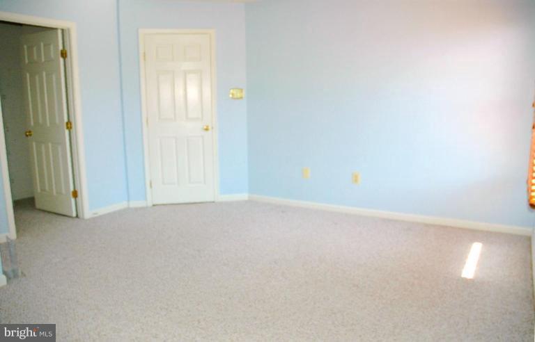 9575 Kings Grant Road Laurel, MD 20723 - Photo 20 of 24 The owners bedroom also has an en suite bath.