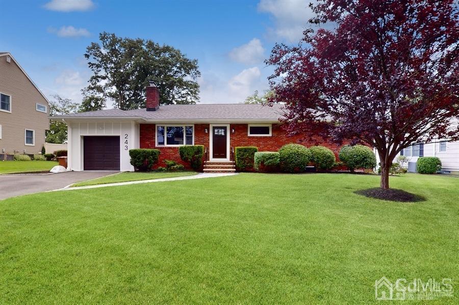 243 Old Tote Road Mountainside, NJ 07092 - Photo 2 of 42 a front view of house with yard and green space