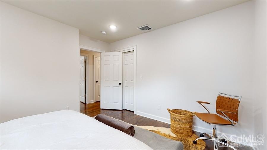243 Old Tote Road Mountainside, NJ 07092 - Photo 27 of 42 a bedroom with a bed and cabinets