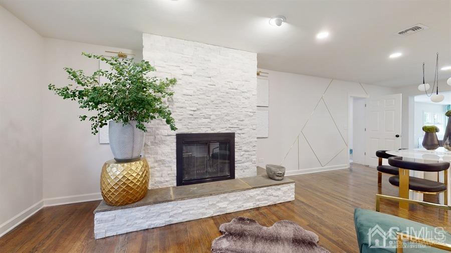 243 Old Tote Road Mountainside, NJ 07092 - Photo 3 of 42 a living room with furniture and a fireplace
