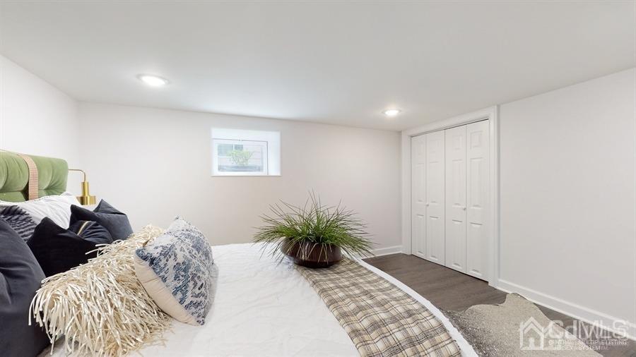 243 Old Tote Road Mountainside, NJ 07092 - Photo 33 of 42 a bedroom with a bed and a couch