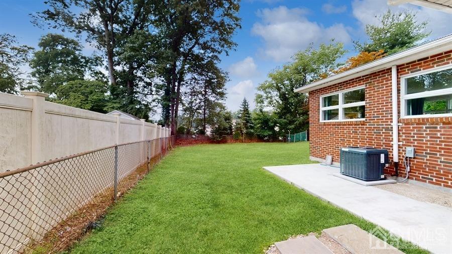 243 Old Tote Road Mountainside, NJ 07092 - Photo 38 of 42 a view of a house with backyard and a tree