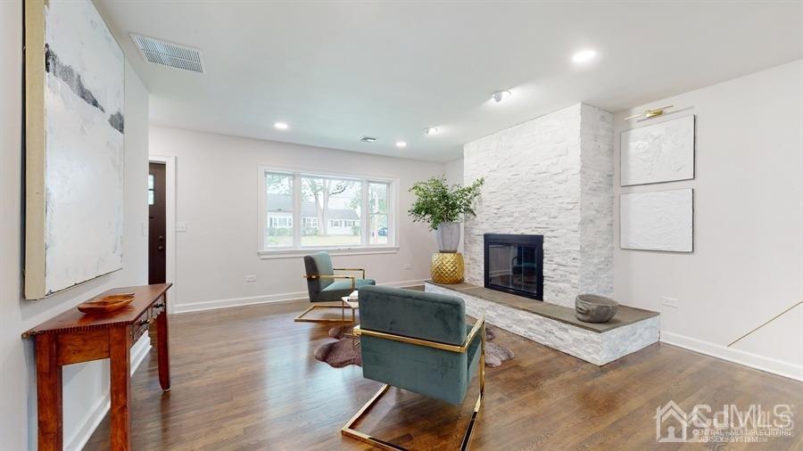 243 Old Tote Road Mountainside, NJ 07092 - Photo 4 of 42 a living room with furniture and a fireplace
