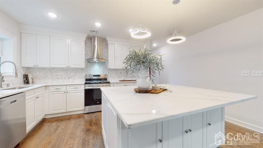 243 Old Tote Road Mountainside, NJ 07092 - Photo 10 of 42 a kitchen with a sink a stove and cabinets
