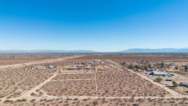an aerial view of residential building and ocean view
