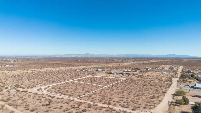 an aerial view of residential building and ocean