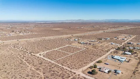 an aerial view of beach and ocean