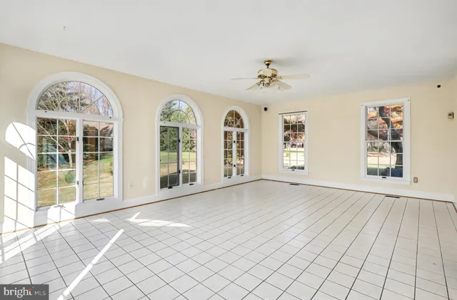 a view of an empty room with windows