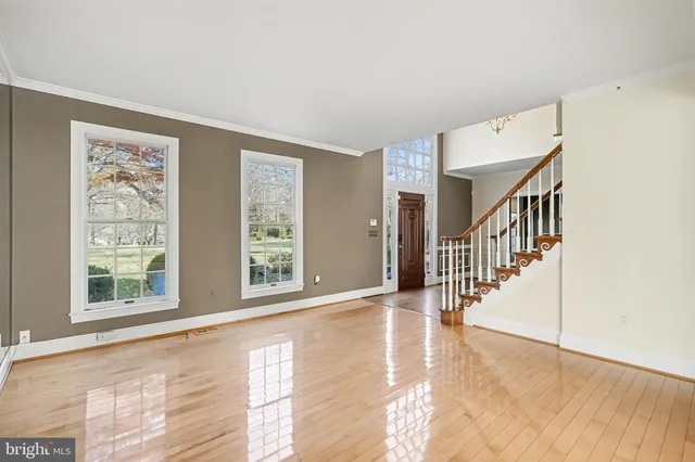 a view of an entryway with wooden floor