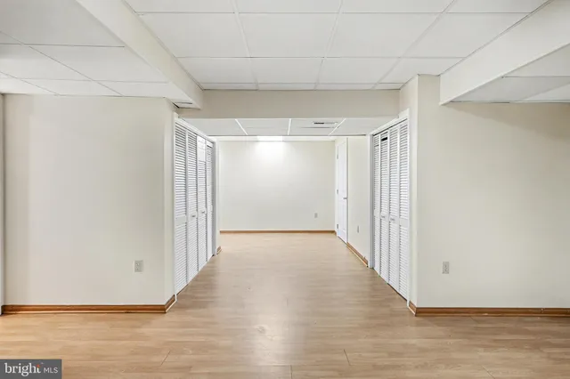 a view of gallery with wooden floor