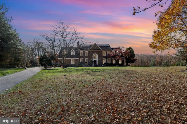 a view of a yard with a house in the background
