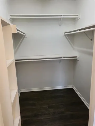 a view of an empty walk in closet