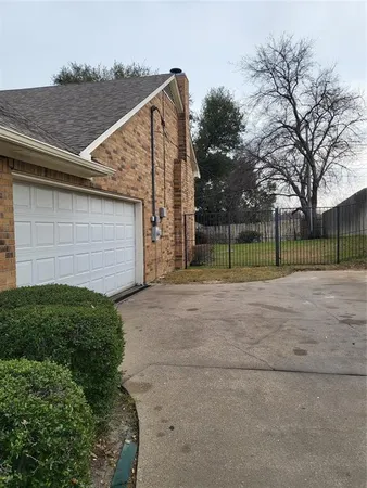 a view of backyard with small plants