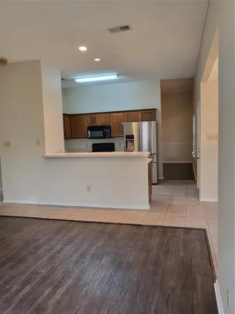 a view of a kitchen with a sink and dishwasher