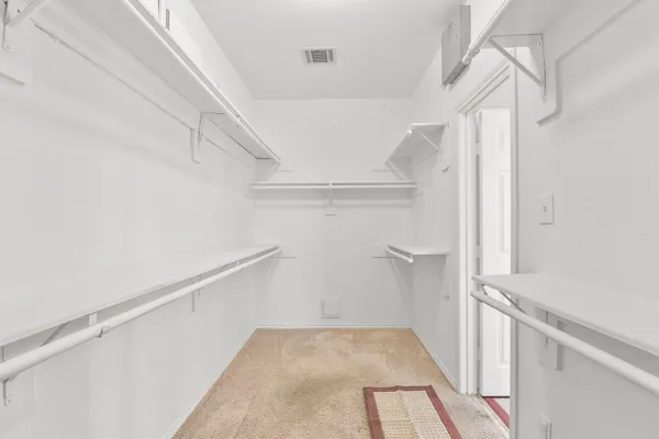 a view of entryway with hallway and stairs