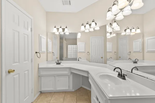 a bathroom with a sink vanity and a mirror