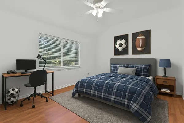 a bedroom with a bed and a window