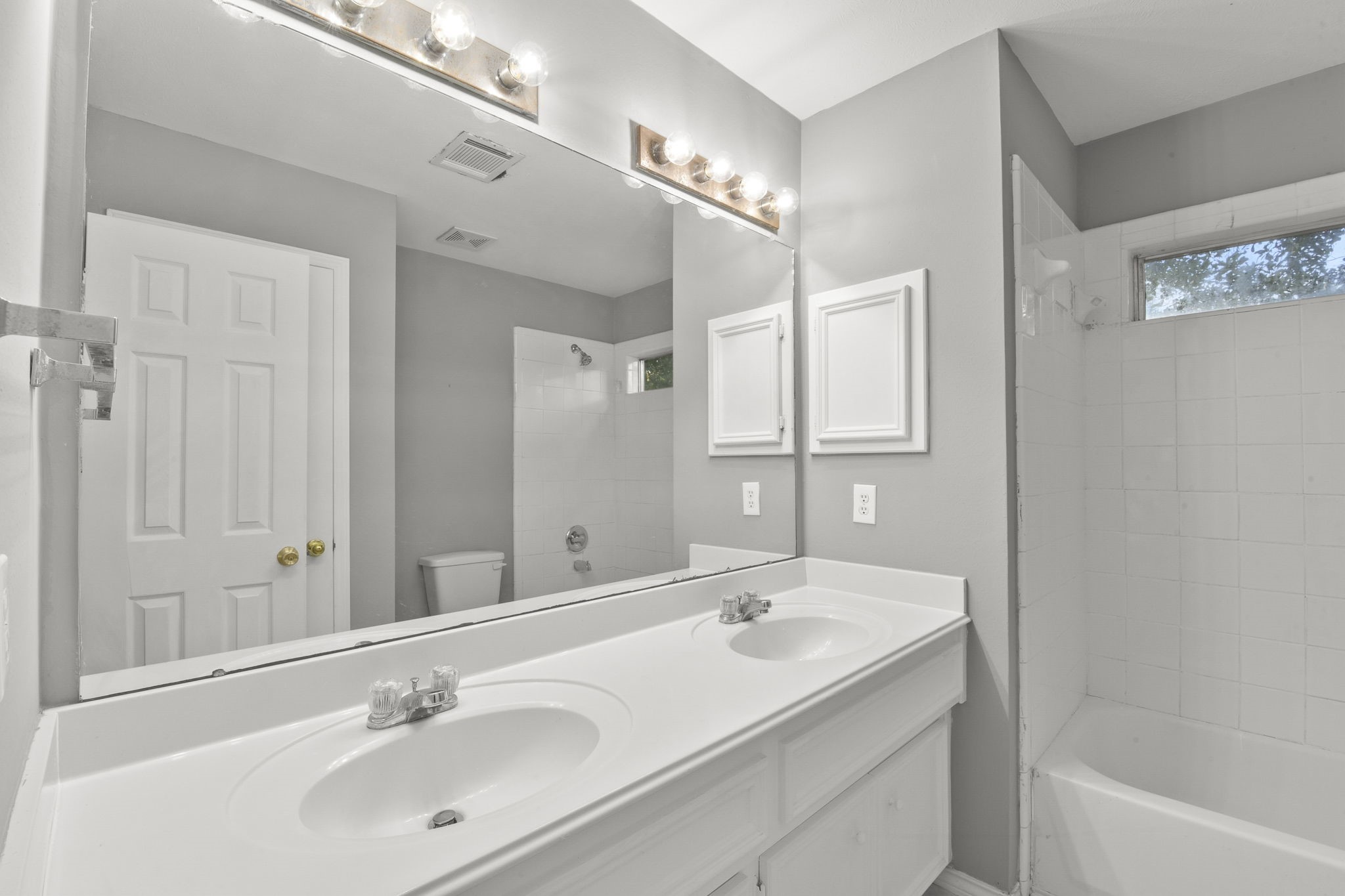 8550 Waiting Spring Circle Houston, TX 77095 - Photo 15 of 32 a bathroom with a sink double vanity granite tub and a mirror