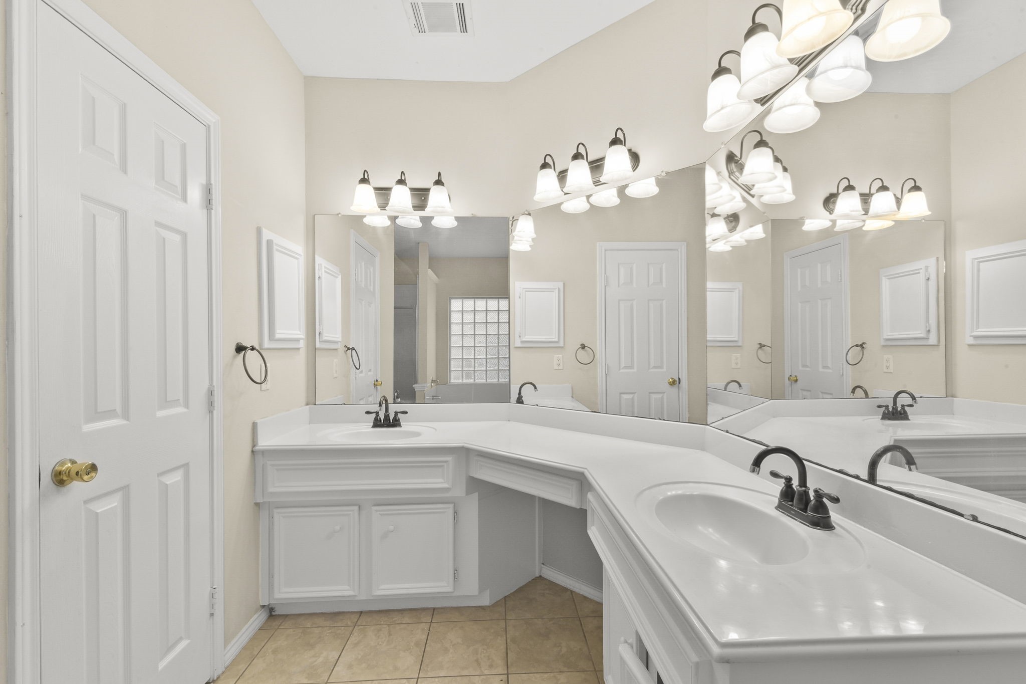 8550 Waiting Spring Circle Houston, TX 77095 - Photo 18 of 32 a bathroom with a sink vanity and a mirror