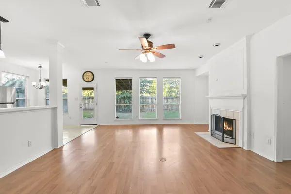 a view of livingroom with fireplace wooden floor and window