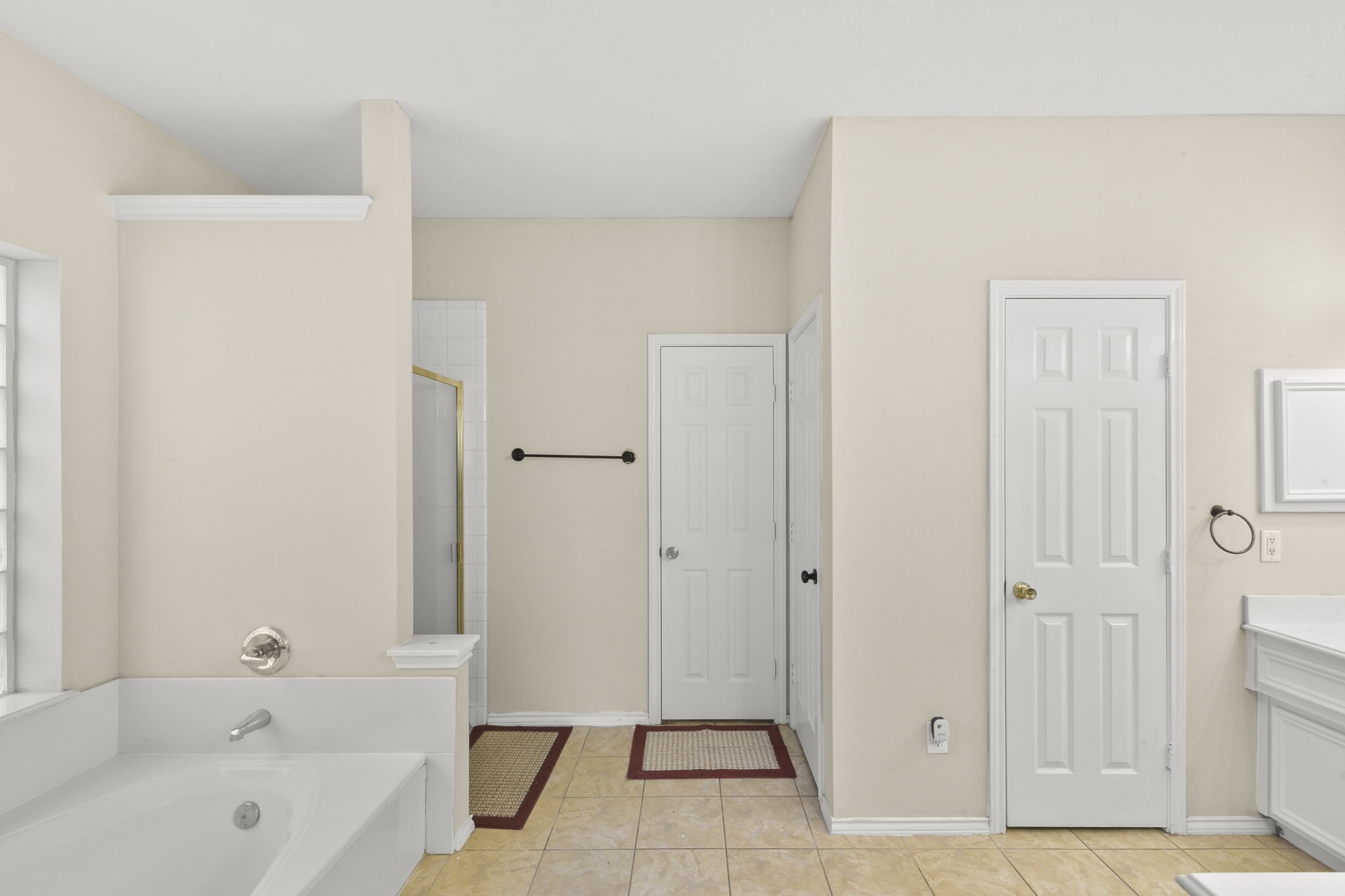 8550 Waiting Spring Circle Houston, TX 77095 - Photo 25 of 32 a bathroom with a bathtub and a shower