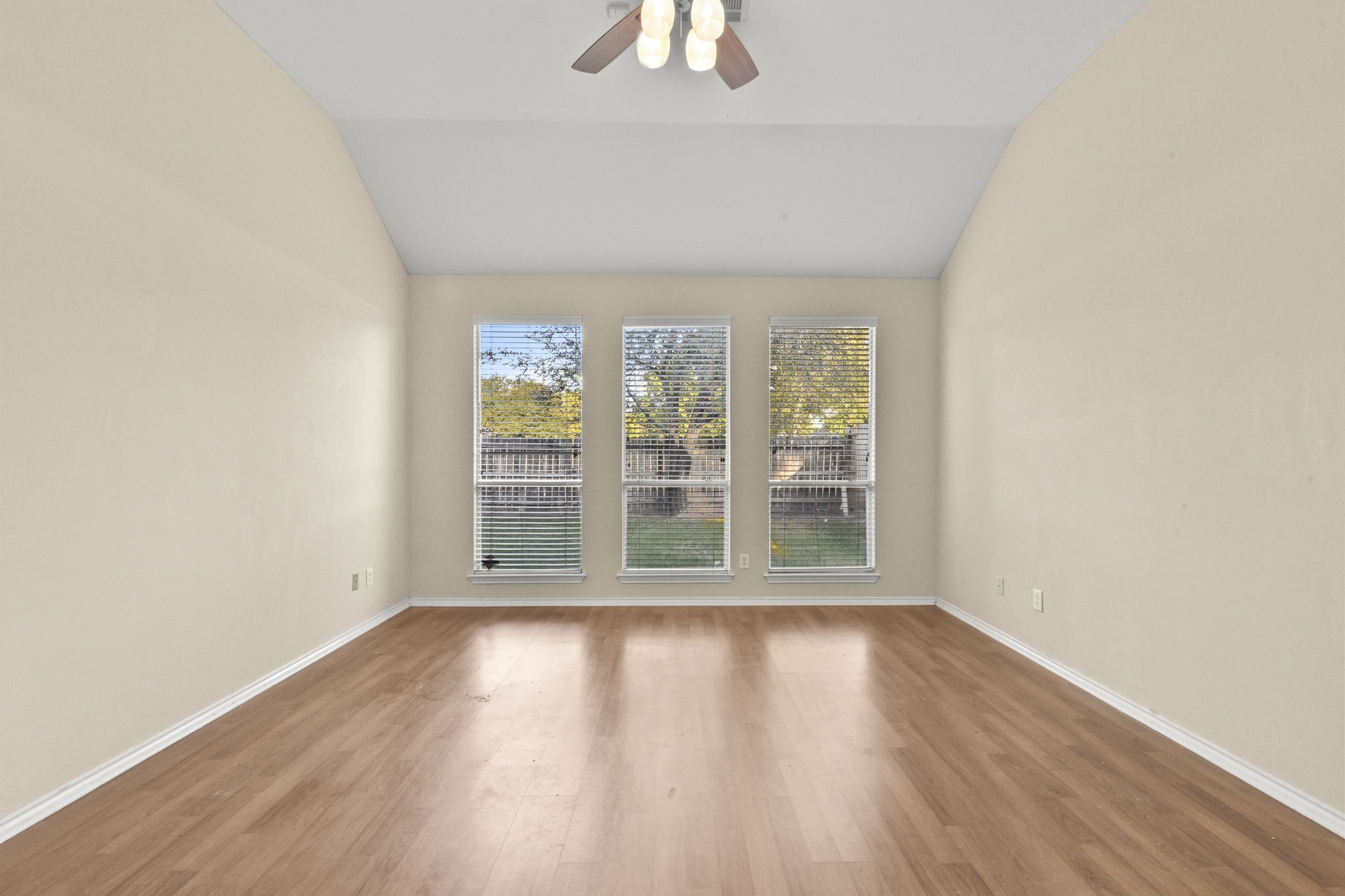 8550 Waiting Spring Circle Houston, TX 77095 - Photo 26 of 32 an empty room with wooden floor and windows