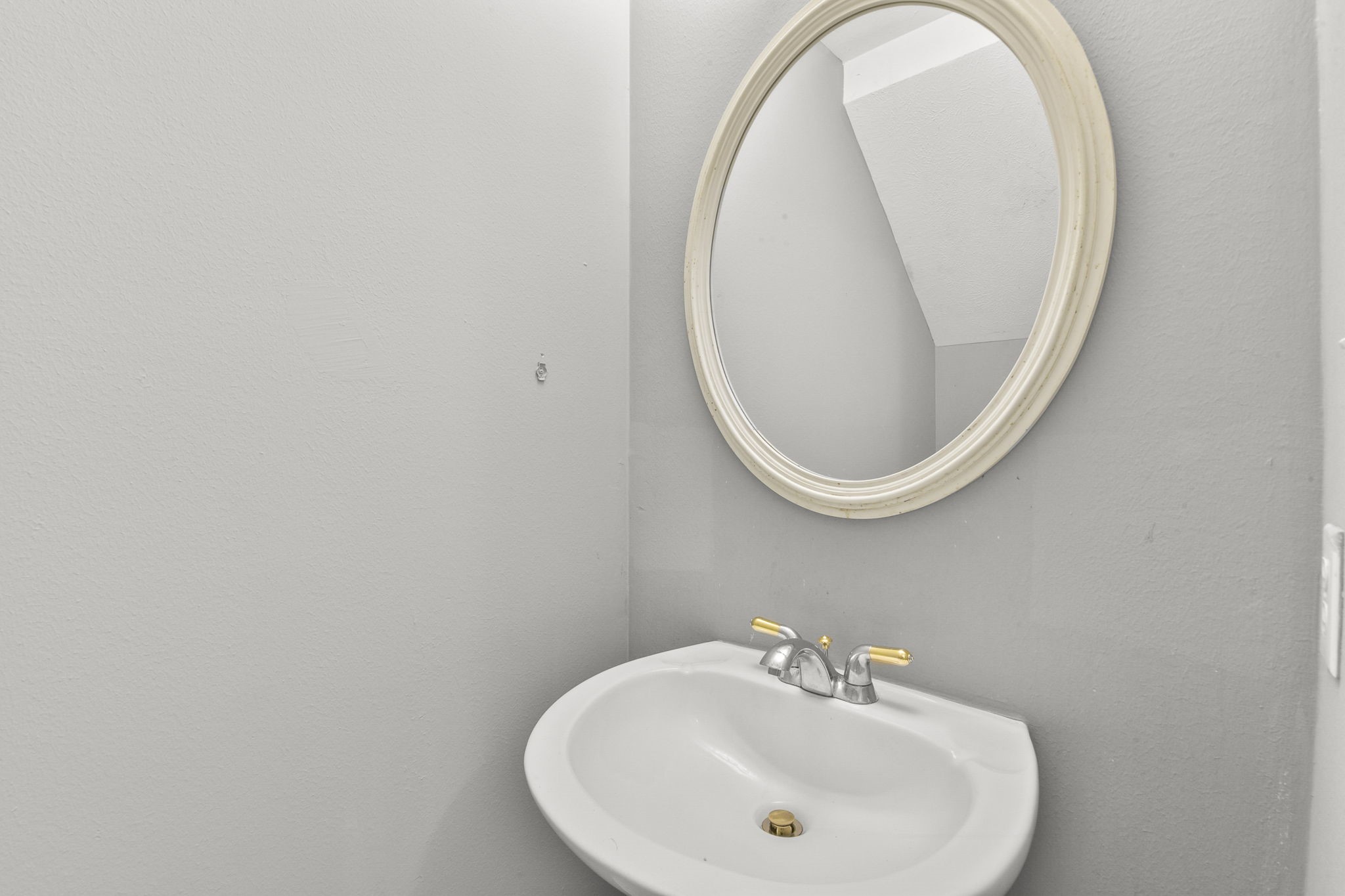 8550 Waiting Spring Circle Houston, TX 77095 - Photo 10 of 32 a bathroom with a sink and a mirror