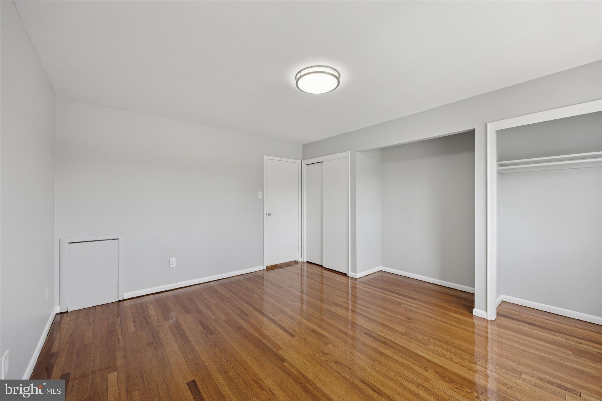 8410 Bustleton Avenue, Unit A 14 Philadelphia, PA 19152 - Photo 6 of 15 a view of an empty room with wooden floor and closet