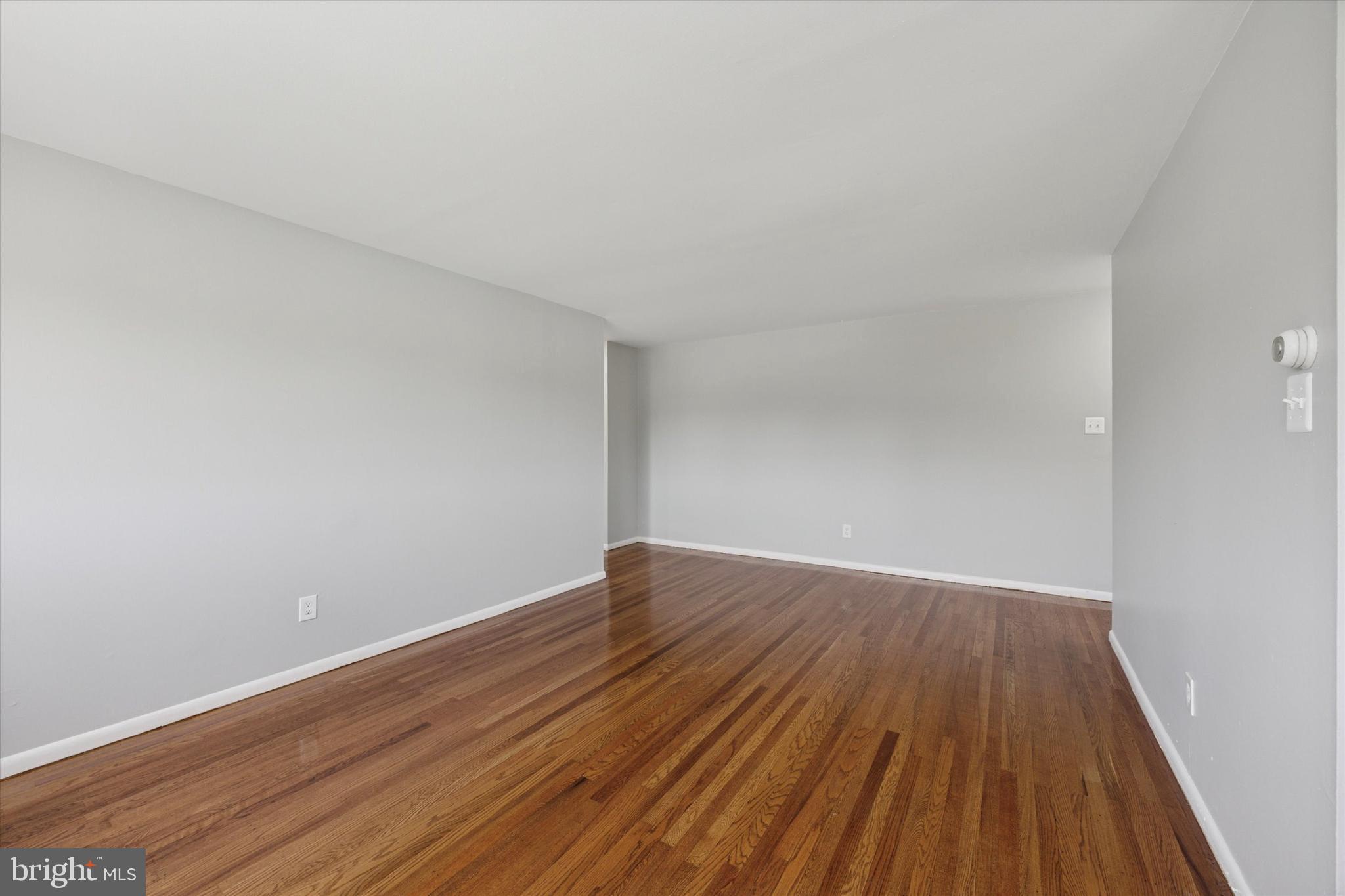 8410 Bustleton Avenue, Unit A 14 Philadelphia, PA 19152 - Photo 9 of 15 a view of an empty room with wooden floor