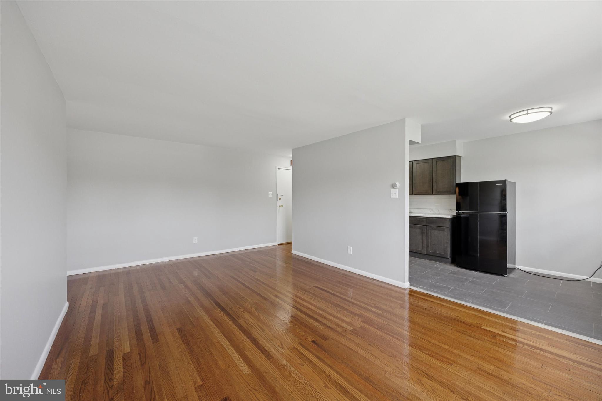 8410 Bustleton Avenue, Unit A 14 Philadelphia, PA 19152 - Photo 10 of 15 a view of an empty room with wooden floor