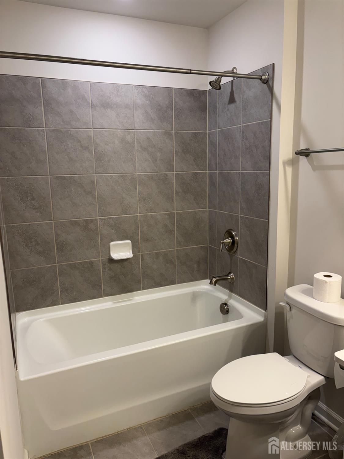 10 Stanton Rd Mount Mount Holly, NJ 08060 - Photo 7 of 8 a bathroom with a toilet bathtub and shower