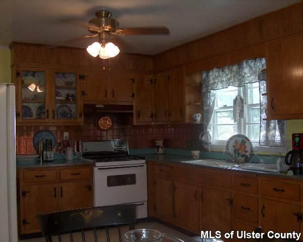 171 Pine Bush Road, Unit CONTINGENCY CONT TO SHOW Stone Ridge, NY 12484 - Photo 3 of 4 a kitchen with a sink cabinets and window