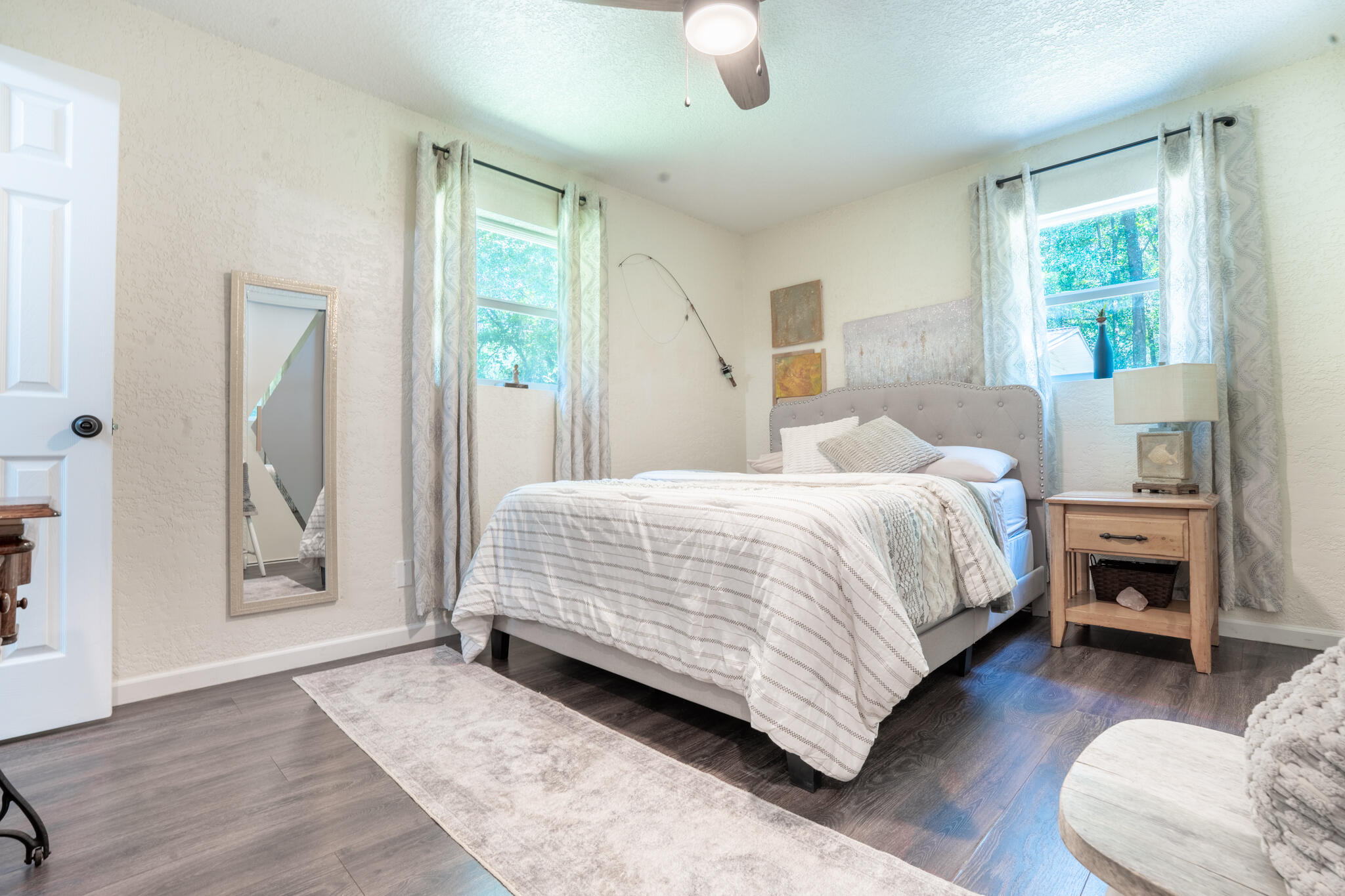 156 Lindberg Street Crestview, FL 32536 - Photo 12 of 25 a bedroom with a bed and wooden floor