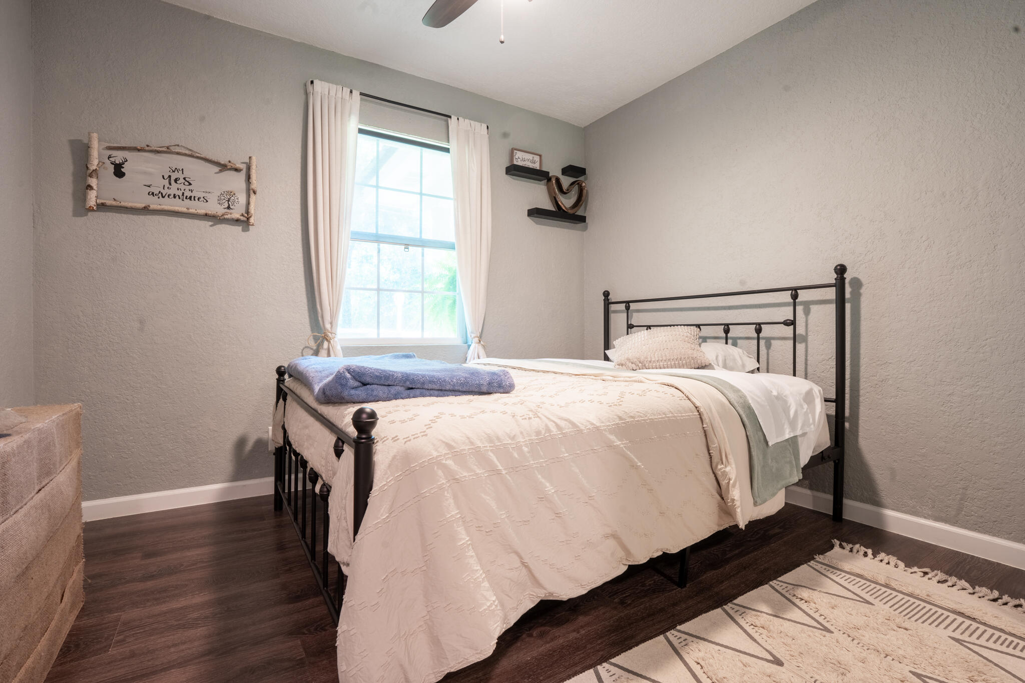 156 Lindberg Street Crestview, FL 32536 - Photo 13 of 25 a bedroom with a bed and wooden floor