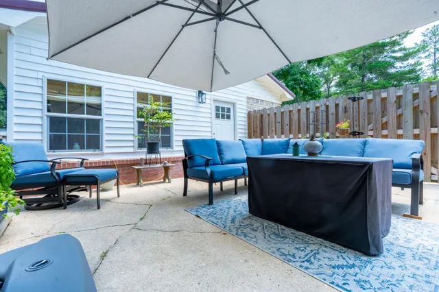 a outdoor space with patio furniture and potted plants