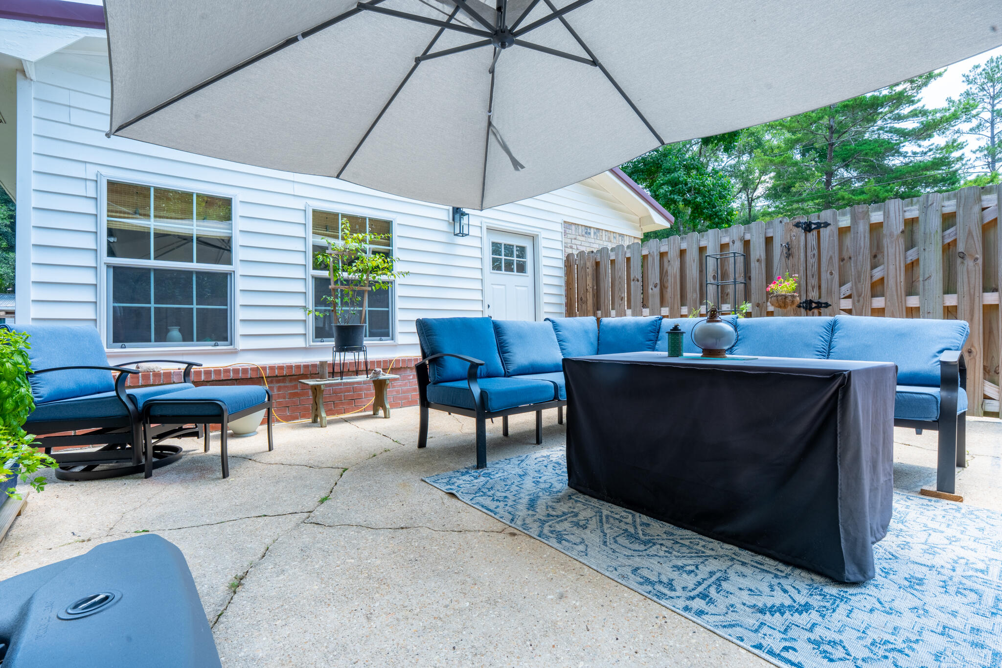 156 Lindberg Street Crestview, FL 32536 - Photo 17 of 25 a outdoor space with patio furniture and potted plants