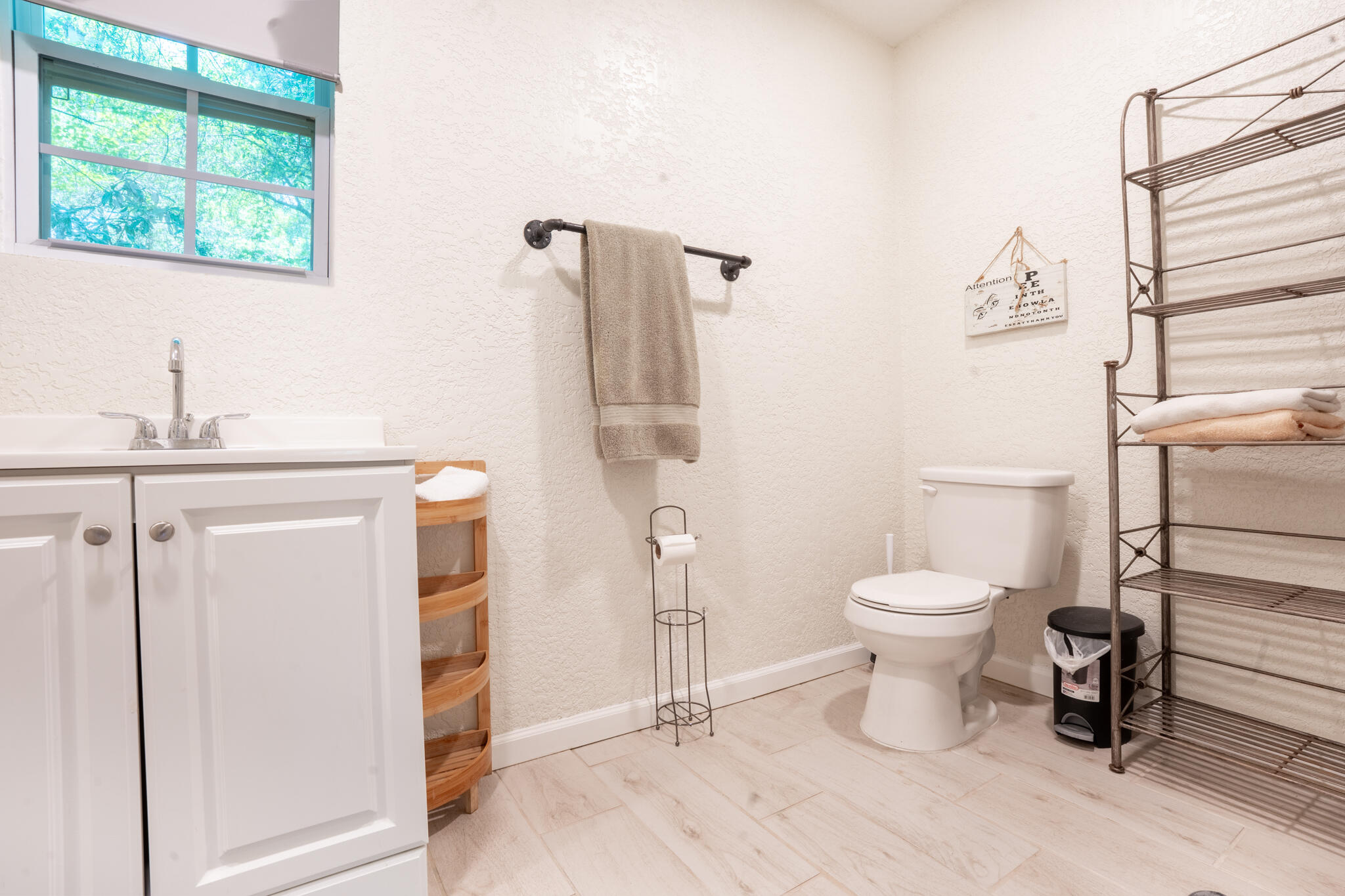 156 Lindberg Street Crestview, FL 32536 - Photo 19 of 25 a white toilet sitting next to a bathroom sink