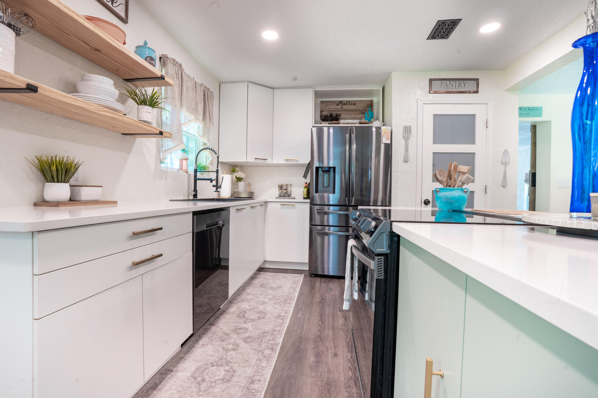156 Lindberg Street Crestview, FL 32536 - Photo 24 of 25 a kitchen with a sink stove and refrigerator