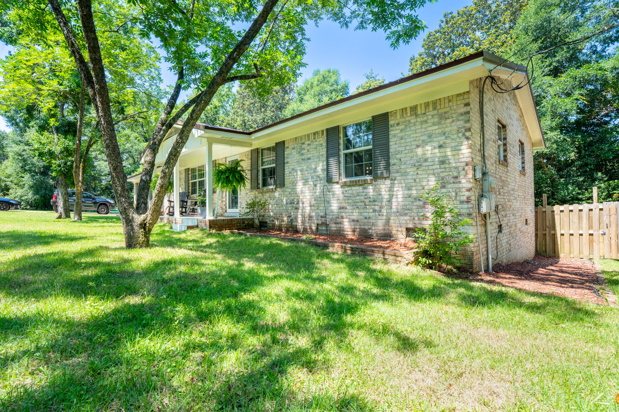 156 Lindberg Street Crestview, FL 32536 - Photo 3 of 25 a view of a house with backyard and a tree