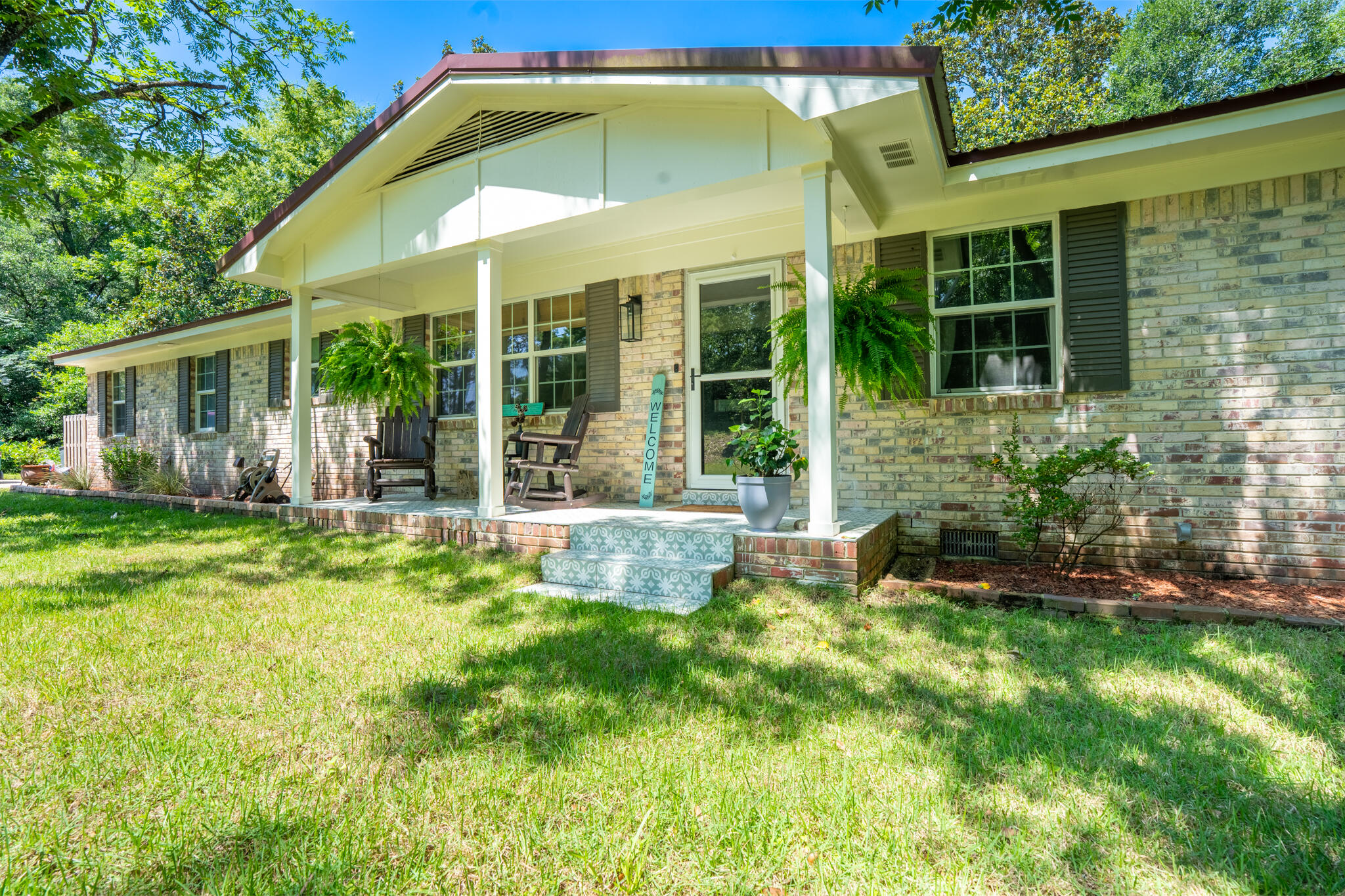 156 Lindberg Street Crestview, FL 32536 - Photo 4 of 25 a view of a house with a yard and sitting area