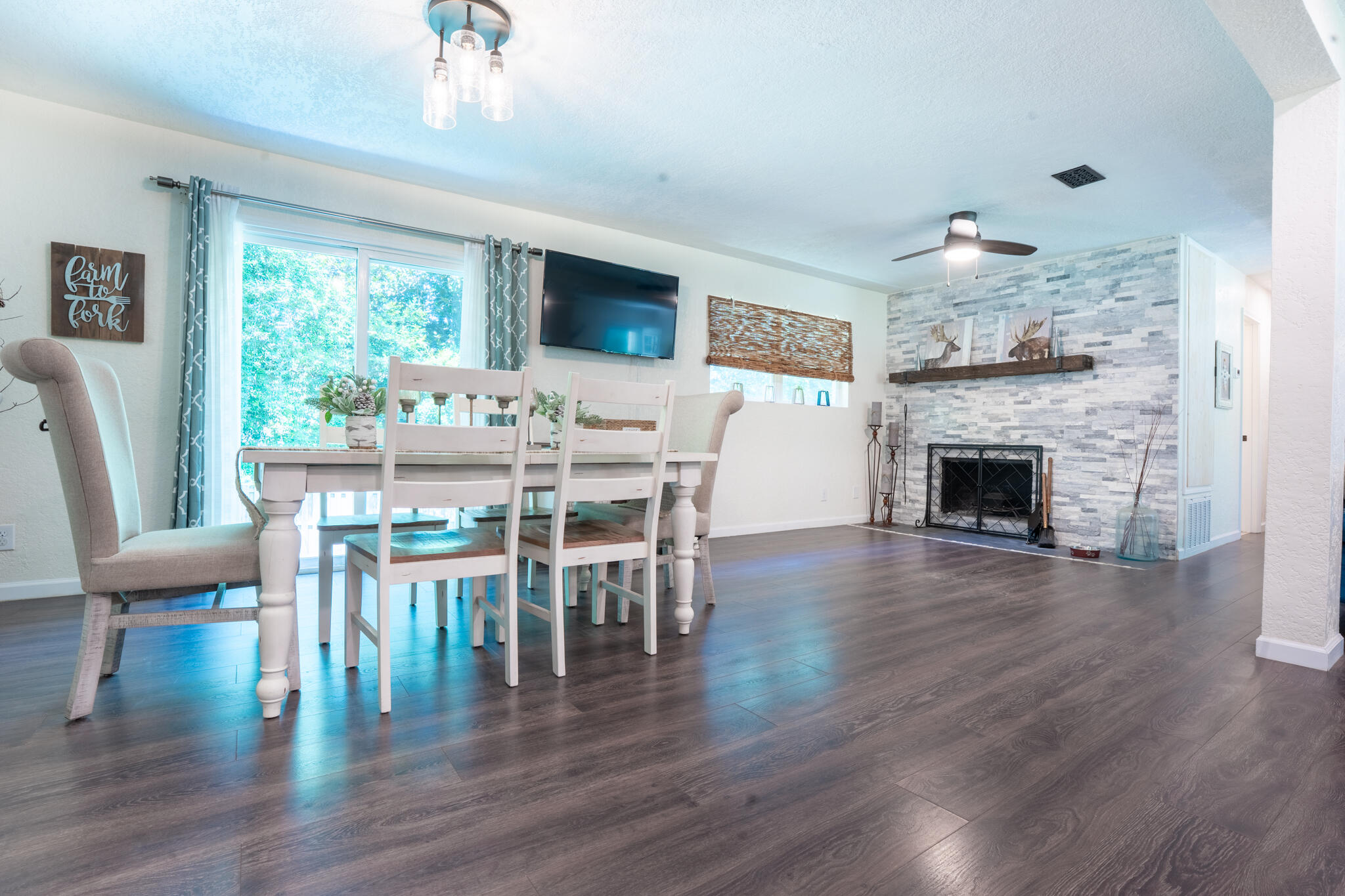 156 Lindberg Street Crestview, FL 32536 - Photo 8 of 25 a view of a dining room with furniture window and wooden floor