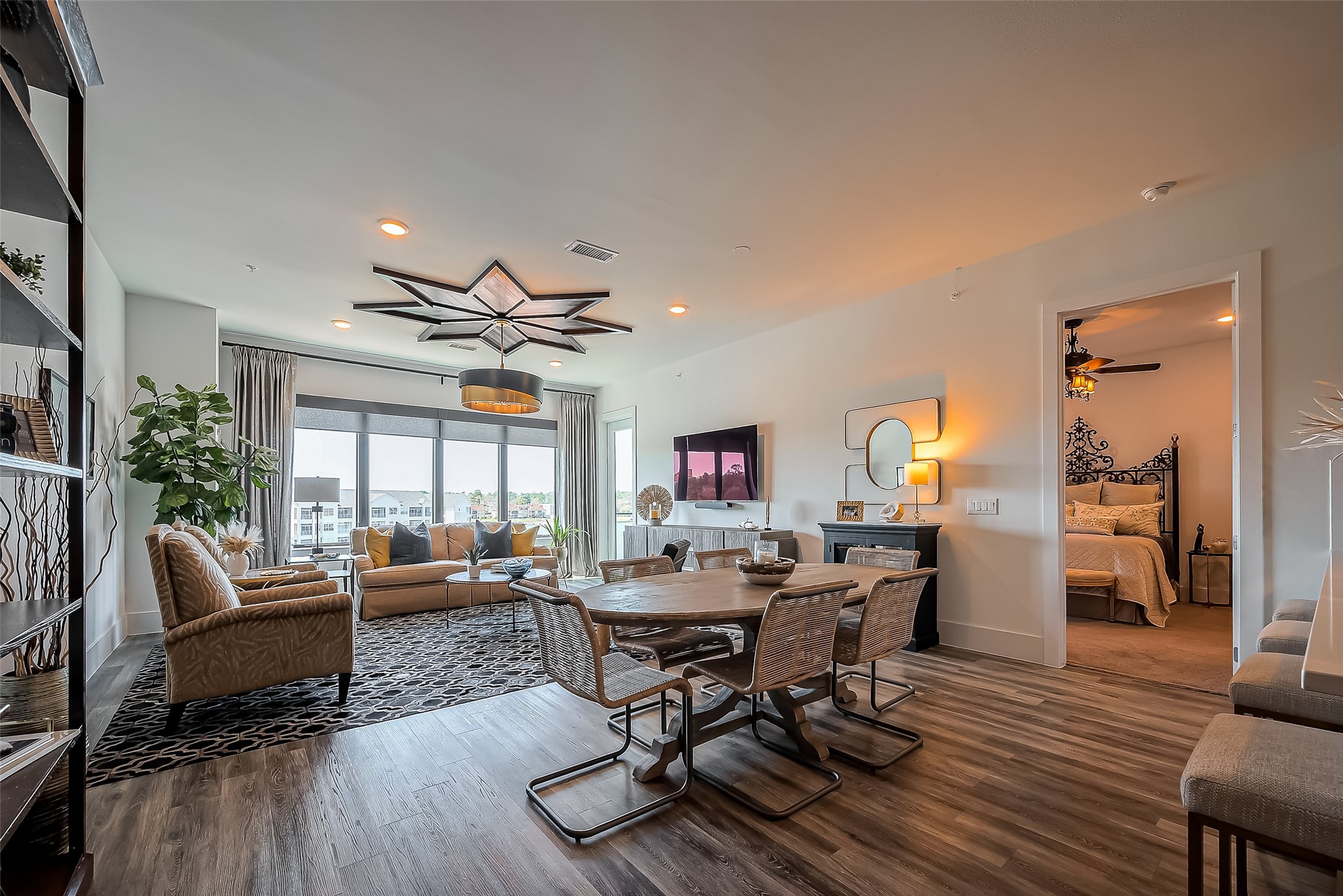 199 Waterpoint Court, Unit 302 Conroe, TX 77356 - Photo 6 of 20 The open concept living and dining areas are bathed in natural light, offering stunning views and a seamless flow for entertaining.