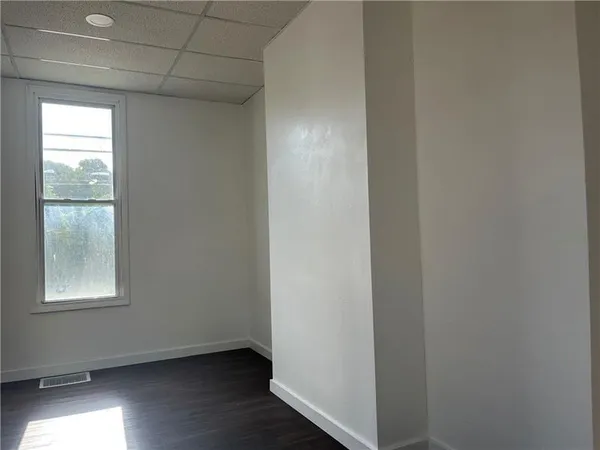 a view of an empty room and window