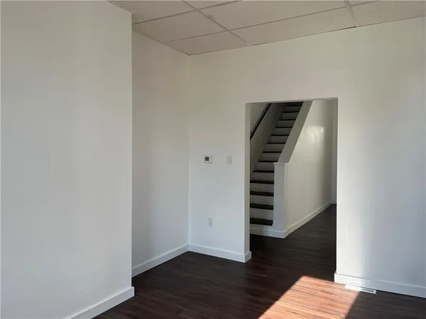 a view of a staircase with white walls